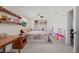 Comfortable bedroom with carpet, toy display shelves and a cute quilt on the bed at 336 Highland Shores Dr, Ellenton, FL 34222