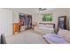 Cozy bedroom with a window, closet, ceiling fan, and comfortable daybed perfect for relaxation at 336 Highland Shores Dr, Ellenton, FL 34222