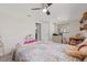 Neutral bedroom with a view of the kitchen, featuring carpet and a ceiling fan at 336 Highland Shores Dr, Ellenton, FL 34222