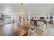 Open dining area with wood table, neutral chairs, and adjacent kitchen and living spaces at 336 Highland Shores Dr, Ellenton, FL 34222