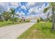 Charming single Gathering home with attached two car garage and palm trees at 336 Highland Shores Dr, Ellenton, FL 34222