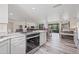 Bright kitchen with a bar that flows into a large living area and dining area at 336 Highland Shores Dr, Ellenton, FL 34222