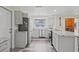 Modern kitchen featuring gray cabinetry, stainless steel appliances, a window view, and stylish countertops at 336 Highland Shores Dr, Ellenton, FL 34222