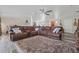 Cozy living room with a plush rug, guitars on the wall, and a large sectional sofa at 336 Highland Shores Dr, Ellenton, FL 34222