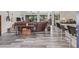 Spacious living room with wood-look flooring, stylish furnishings and plenty of natural light at 336 Highland Shores Dr, Ellenton, FL 34222