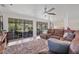 Bright living room featuring sliding glass doors to an outdoor living space at 336 Highland Shores Dr, Ellenton, FL 34222