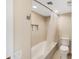Bright bathroom featuring a shower-tub combination with a built-in niche for toiletries at 3658 Torrey Pines Way, Sarasota, FL 34238