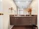 Bathroom with a modern vanity and a decorative mirror at 3658 Torrey Pines Way, Sarasota, FL 34238
