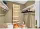 Organized walk-in closet with shelves, hanging racks, and floor-level storage provides ample space at 3658 Torrey Pines Way, Sarasota, FL 34238