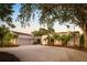 Lovely home featuring a brick driveway, basketball hoop and lush, tropical landscaping at 3658 Torrey Pines Way, Sarasota, FL 34238