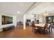 Open-concept living area with tile floors and plenty of space for entertaining guests at 3658 Torrey Pines Way, Sarasota, FL 34238