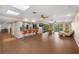 Spacious living room with skylights, tile flooring, and a view of the pool at 3658 Torrey Pines Way, Sarasota, FL 34238