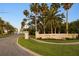 A street view of the Country Club of Sarasota sign and entrance at 3658 Torrey Pines Way, Sarasota, FL 34238