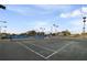 A well-maintained tennis court at Sarasota Sports Club, complete with lighting for evening play at 3658 Torrey Pines Way, Sarasota, FL 34238