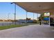 Tennis courts with covered seating adjacent to the Sarasota Sports Club at 3658 Torrey Pines Way, Sarasota, FL 34238