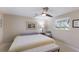 Bright bedroom features a ceiling fan, and comfortable decor with a view to the outside at 3715 Bamboo Ter, Bradenton, FL 34210