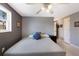 Cozy bedroom with comfortable queen bed, ceiling fan, window, and neutral paint at 3715 Bamboo Ter, Bradenton, FL 34210