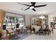 Bright dining area with chandelier and view of seating, and easy access to kitchen at 3715 Bamboo Ter, Bradenton, FL 34210