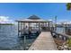Picturesque gazebo-covered dock extending into the water, offering a serene spot to relax and enjoy waterfront views and tranquility at 3715 Bamboo Ter, Bradenton, FL 34210