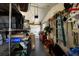 Messy garage with storage shelving units filled with tools, lawn equipment, and other stored items at 3715 Bamboo Ter, Bradenton, FL 34210