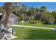 Lush green grounds featuring a historic barn and propeller display, offering a glimpse into maritime history and a peaceful outdoor setting at 3715 Bamboo Ter, Bradenton, FL 34210