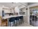 Contemporary kitchen features modern bar seating, updated appliances, white cabinets, and plenty of counter space at 3715 Bamboo Ter, Bradenton, FL 34210