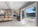 Bright living room with sliding glass doors, providing easy access to waterfront at 3715 Bamboo Ter, Bradenton, FL 34210