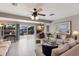 Inviting living room featuring tile flooring, sliding glass doors, and waterfront views at 3715 Bamboo Ter, Bradenton, FL 34210