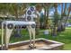 Unique horse sculpture fountain surrounded by well-maintained lawns and tropical landscaping, enhancing the outdoor ambiance at 3715 Bamboo Ter, Bradenton, FL 34210