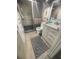 Tiled bathroom with updated vanity, framed mirror, and glass-enclosed walk-in shower at 3806 Gulf Of Mexico Dr # C205, Longboat Key, FL 34228