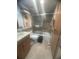 Bathroom featuring shower-tub combination, grab bars, vanity and tile flooring at 3806 Gulf Of Mexico Dr # C205, Longboat Key, FL 34228