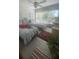 Bright bedroom with twin beds, sunny windows, and a coordinating decor at 3806 Gulf Of Mexico Dr # C205, Longboat Key, FL 34228