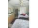 This cozy bedroom offers a calming atmosphere with carpet floors and a ceiling fan at 3806 Gulf Of Mexico Dr # C205, Longboat Key, FL 34228