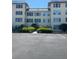 Well-maintained condo building with manicured landscaping and convenient parking at 3806 Gulf Of Mexico Dr # C205, Longboat Key, FL 34228