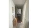 Well-lit hallway decorated with artwork, leading to other rooms in the home at 3806 Gulf Of Mexico Dr # C205, Longboat Key, FL 34228