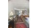 Cozy living room and dining area with carpet, built in cabinet and crown molding at 3806 Gulf Of Mexico Dr # C205, Longboat Key, FL 34228
