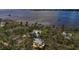 An aerial view of houses surrounded by lush greenery and stunning waterfront views at 403 29Th Nw St, Bradenton, FL 34205