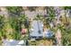 Overhead view of a charming home with lush surroundings and an outdoor patio at 403 29Th Nw St, Bradenton, FL 34205