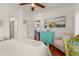 Light-filled bedroom features wooden floors, comfortable chair and colorful dresser at 403 29Th Nw St, Bradenton, FL 34205