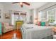 Bright bedroom with a bed with decorative pillows and a desk with a chair at 403 29Th Nw St, Bradenton, FL 34205