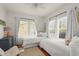 Bright bedroom showcasing two twin beds, a dresser, and ample natural light at 403 29Th Nw St, Bradenton, FL 34205