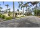 Charming yellow cottage-style home featuring a screened porch and well-maintained landscaping at 403 29Th Nw St, Bradenton, FL 34205