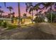 Charming yellow cottage-style home featuring a screened porch and well-maintained landscaping at 403 29Th Nw St, Bradenton, FL 34205