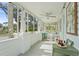 Cozy screened front porch with comfortable rocking chairs and natural light at 403 29Th Nw St, Bradenton, FL 34205