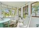 Inviting front porch with rocking chairs and views of the well-manicured lawn at 403 29Th Nw St, Bradenton, FL 34205
