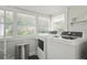 Convenient laundry room features modern appliances, ample natural light, and storage at 403 29Th Nw St, Bradenton, FL 34205