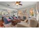 Cozy living room featuring hardwood floors, a brick fireplace and decorative lighting at 403 29Th Nw St, Bradenton, FL 34205