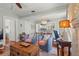 Open-concept living room with hardwood floors that flows into the dining room and kitchen at 403 29Th Nw St, Bradenton, FL 34205