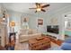 Bright and airy living room with hardwood floors, a cozy couch, and lots of natural light at 403 29Th Nw St, Bradenton, FL 34205