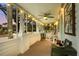 Inviting screened porch featuring comfortable seating, string lights, and serene outdoor views at 403 29Th Nw St, Bradenton, FL 34205